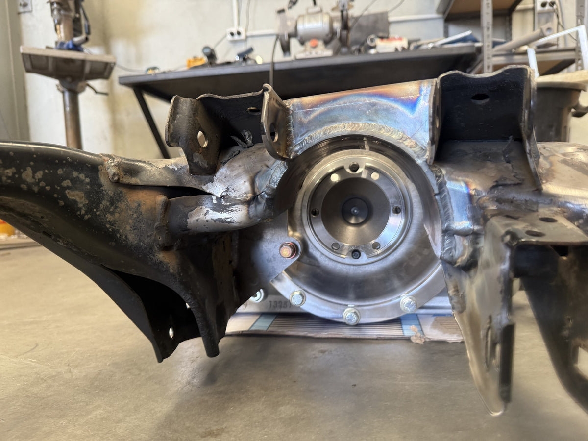Side view of the GR86 subframe at the axle flange, showing the welded diff mount