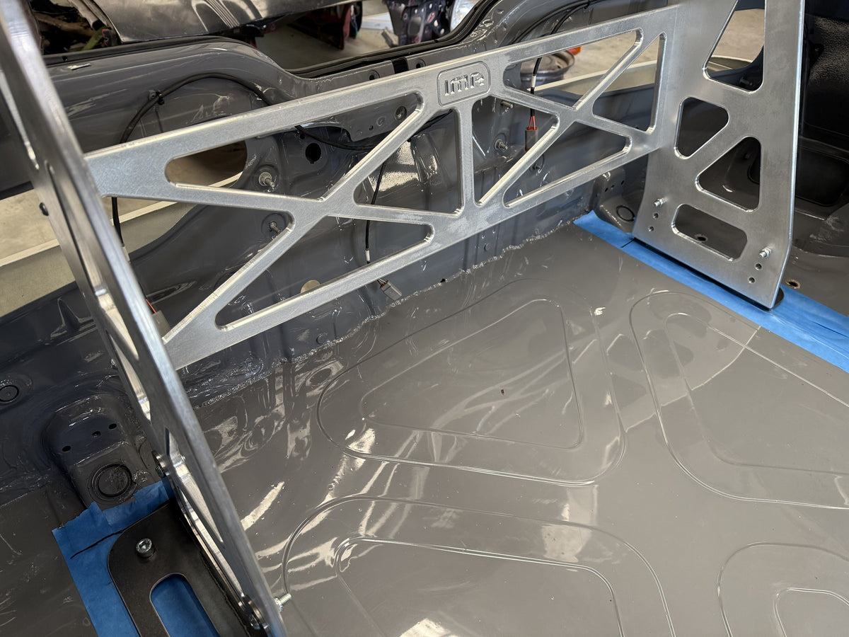 CNC machined IMR chassis frame for the Integra DC2 wing mounts, bolted to the weld-down chassis mounts