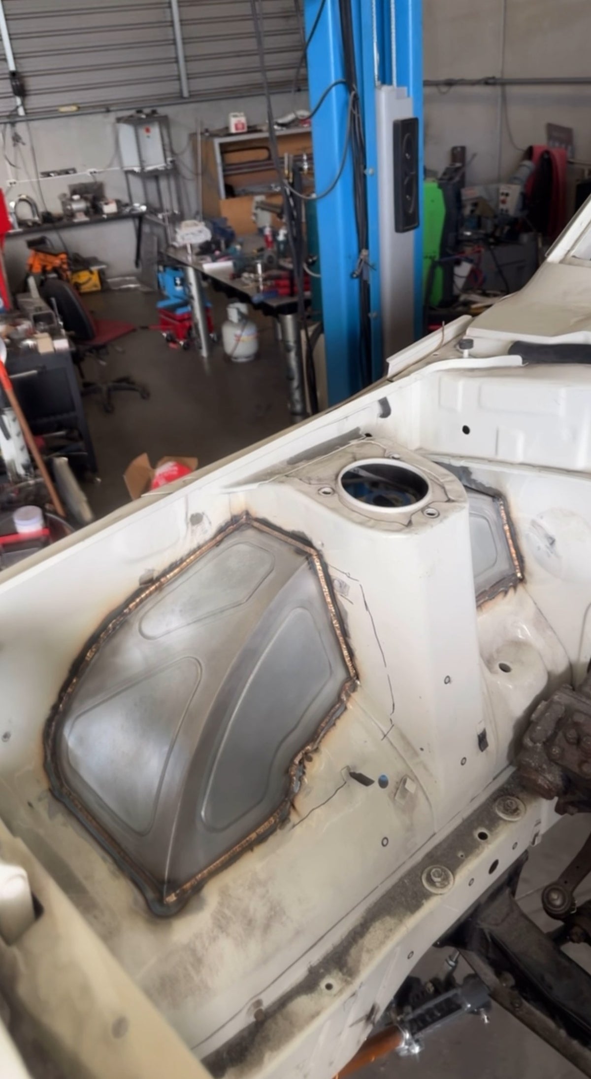 IMR 1.2mm bead-rolled steel front tub welded in beside the Mazda RX3 strut tower
