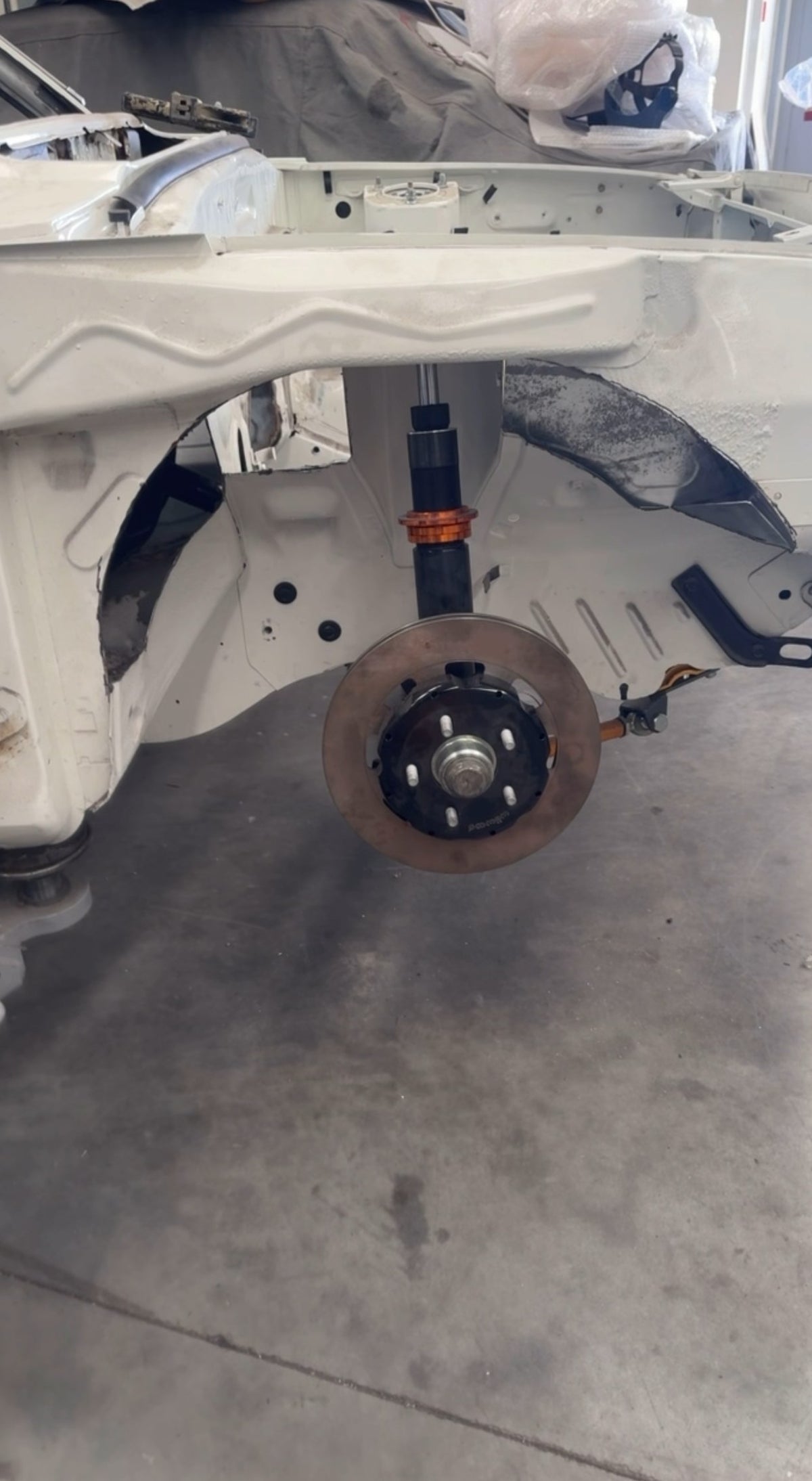 Mazda RX3 front wheel arch with IMR tubs fitted, coilover and hub in place for 17 inch wheels