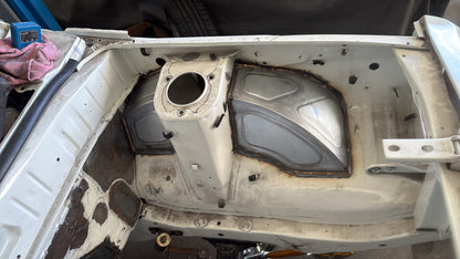 IMR Mazda RX3 front tubs welded in, seen from the front of the engine bay