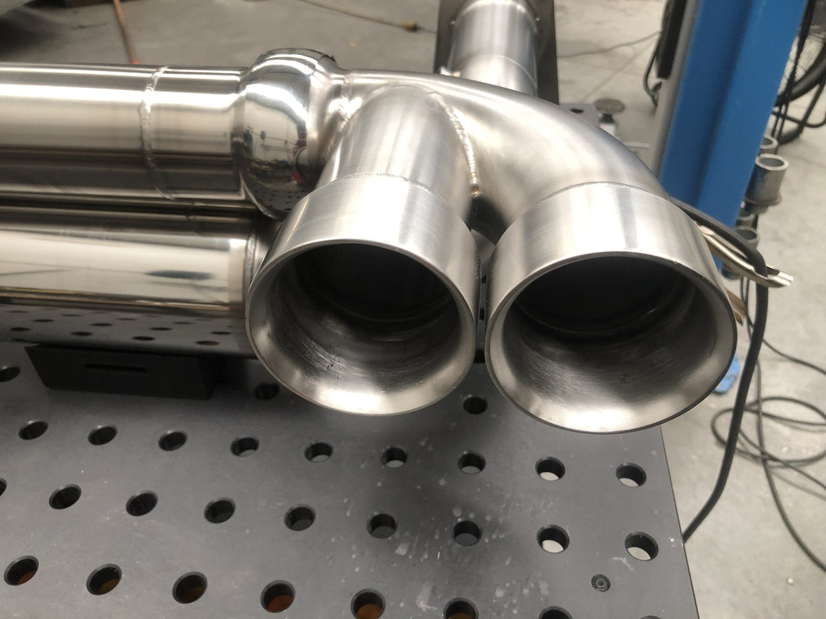 Stainless quad tips on the IMR Porsche 997 Turbo exhaust